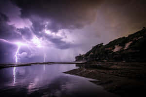 Light Purple Lightning Over Water Wallpaper