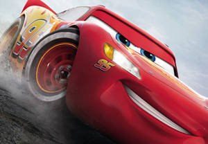 Lightning Mcqueen Racing On Track Wallpaper