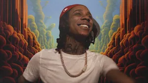 Lil Jeff Smiling Confidently Wallpaper