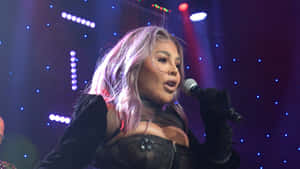 Lil Kim_ Performing_on_ Stage.jpg Wallpaper