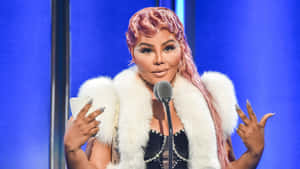 Lil Kim Speakingat Event.jpg Wallpaper