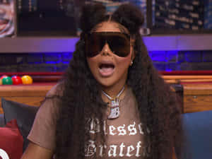 Lil Kim Sunglassesand Buns Hairstyle Wallpaper