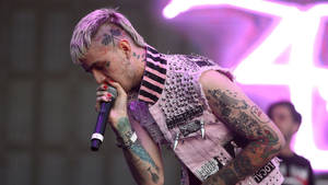 Lil Peep Performing Live On Stage At An Emo Rock Concert Wallpaper