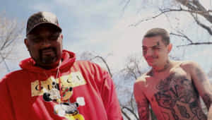 Lil Travieso And Collaborator Outdoors Wallpaper