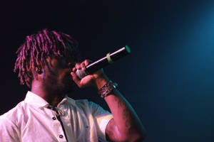 Lil Uzi Vert Singing In The Spotlight Wallpaper