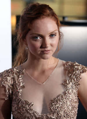 Lily Cole Gracing A Red Carpet Event In A Stunning Designer Dress. Wallpaper