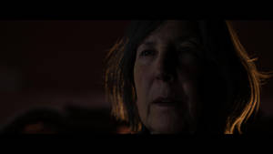 Lin Shaye In Dark Room Wallpaper