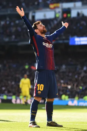 Lionel Messi Exults In Triumphant Celebration Wallpaper