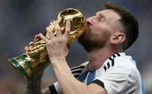 Lionel Messi Kissing World Cup Trophy Wallpaper