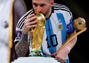 Lionel Messi Kissing World Cup Trophy Wallpaper