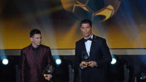 Lionel Messi With His Ballon D'or Award Wallpaper