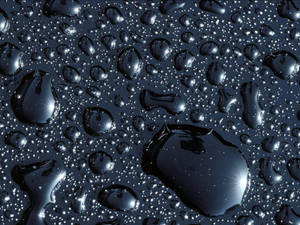 Liquid Drops On Black Wallpaper