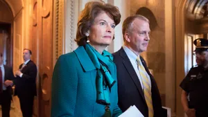 Lisa Murkowski Walking With Stylish Man Wallpaper