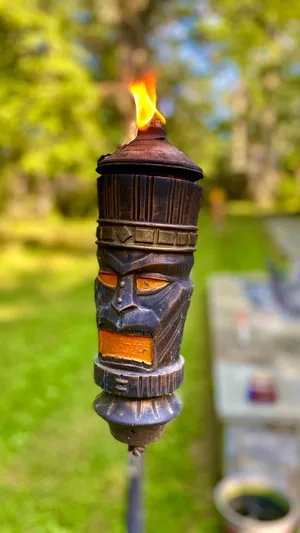 Lit Tiki Torch Garden Decor Wallpaper