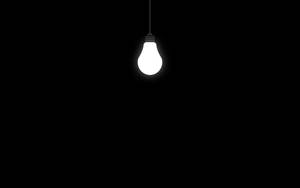 Lit Up Bulb On Black Pc Wallpaper