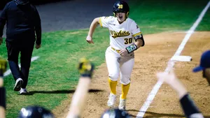 Little League Baseball Team In Action On The Field Wallpaper