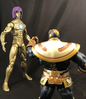 Living Tribunaland Thanos Action Figures Wallpaper