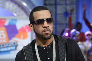 Lloyd Banks Sunglassesand Checkered Vest Wallpaper