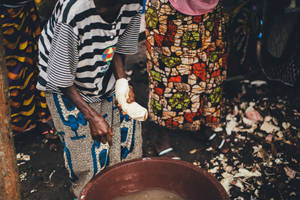 Local Women In Sierra Leone By The Basin Wallpaper