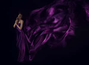 Look Radiant In A Stunning Purple Dress Wallpaper