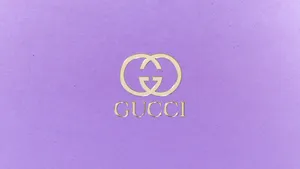 Look Sophistication And Luxury In This Elegant Purple Gucci Look. Wallpaper