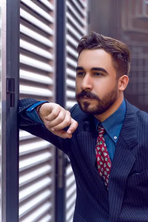 Look Stylish And Professional With A Navy Blue Blazer Wallpaper