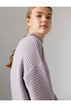 Look Stylish And Stay Cozy In This Beautiful Purple Turtleneck Sweater. Wallpaper