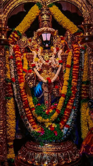 Lord Balaji Adornedin Flowersand Jewelry Wallpaper