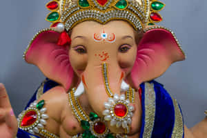 Lord Ganesha Statue Adornedin Jewels Wallpaper