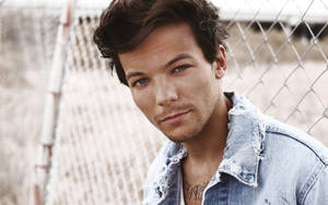 Louis Tomlinson Looking Stylish In A Jean Jacket Wallpaper