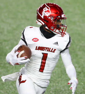 Louisville Football Player Running With Ball Wallpaper