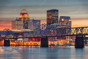 Louisville Skyscrapers And Bridge During Sunset Wallpaper