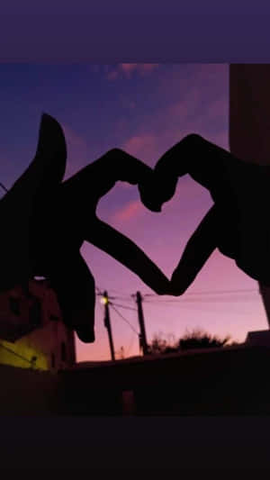 Love In Shadows - Heart Silhouette Against A Sunset Wallpaper