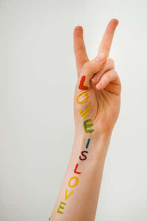 Love Is Love Peace Sign Painted Arm Wallpaper