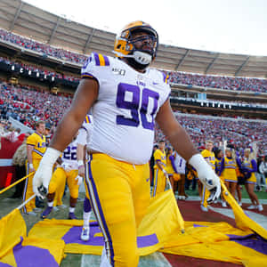 Lsu Football Player Walking Wallpaper