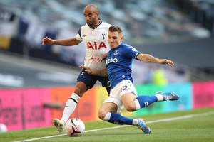 Lucas Digne Chasing Ball On Field Wallpaper