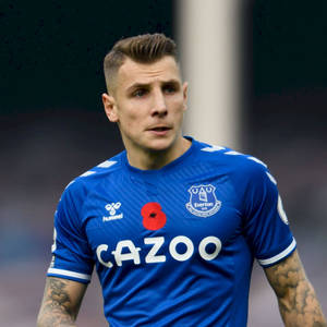 Lucas Digne Wearing Blue Everton Jersey Wallpaper