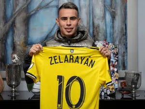 Lucas Zelarayan Holding His Columbus Crew Jersey Wallpaper
