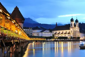 Lucerne Chapel Bridgeand Jesuit Churchat Dusk Wallpaper