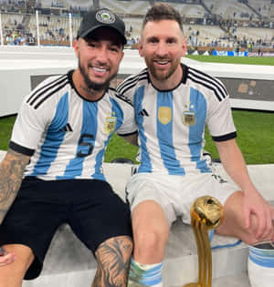 Luciano Acosta With Football Legend Messi Wallpaper