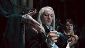 Lucius_ Malfoy_ Holding_ Wand Wallpaper