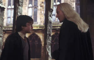 Lucius Malfoyand Boy Wizard Confrontation Wallpaper