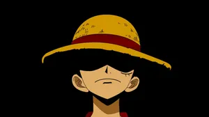 Luffy Black Backdrop With Iconic Straw Hat Wallpaper