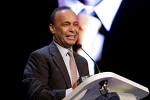 Luis Gutiérrez Smiling White Giving A Speech Wallpaper