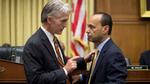 Luis Gutiérrez Talking To A Man Wallpaper