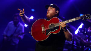 Luke Combs Performing In Concert Wallpaper