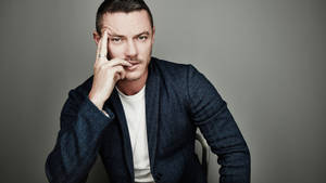 Luke Evans Thinking Pose Wallpaper