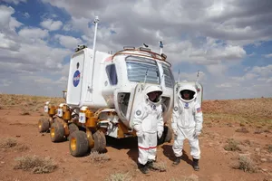 Lunar Rover Traversing The Moon's Surface Wallpaper