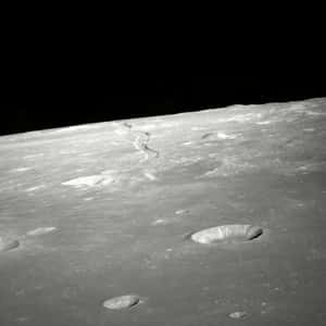 Lunar_ Surface_with_ Craters_and_ Rilles.jpg Wallpaper