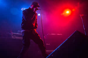 Lupe Fiasco Performing Liveon Stage Wallpaper